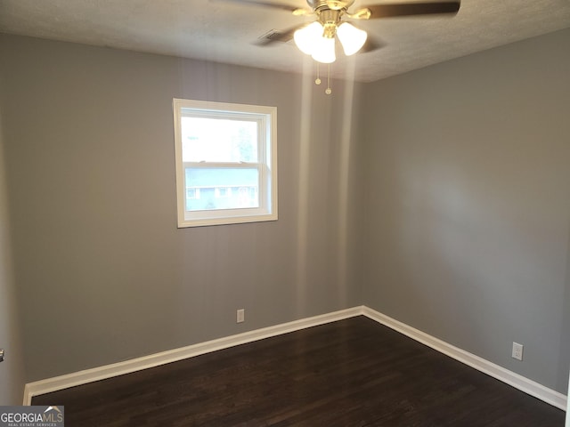 unfurnished room featuring hardwood / wood-style flooring and ceiling fan