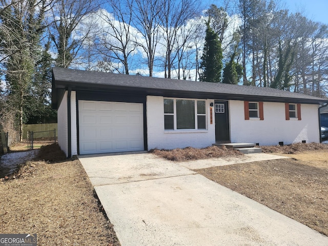 ranch-style home featuring a garage