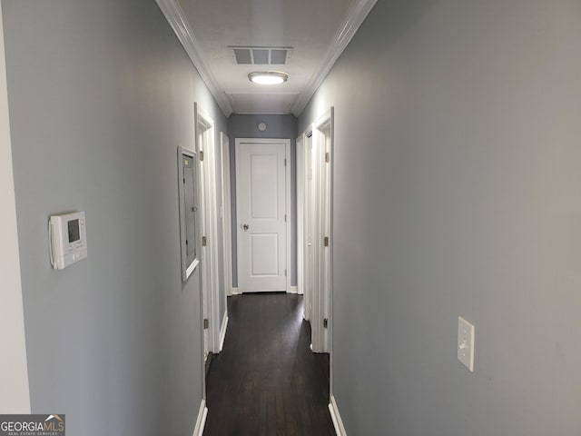 corridor featuring crown molding and dark hardwood / wood-style flooring