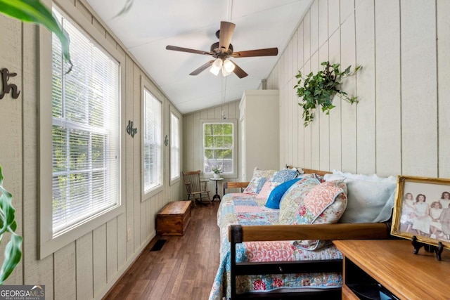 sunroom featuring lofted ceiling and ceiling fan