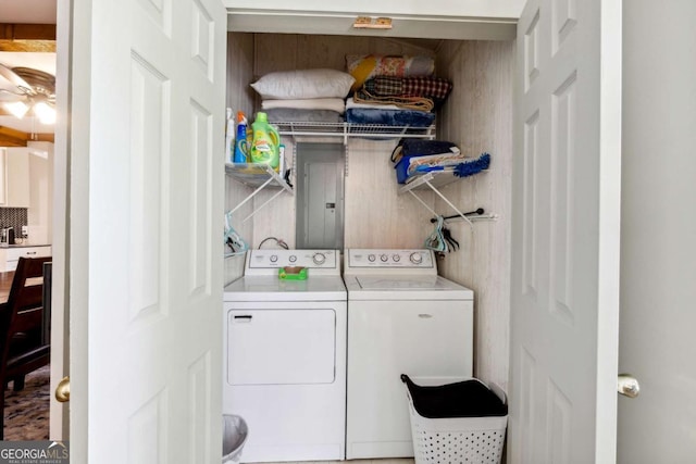 laundry room with separate washer and dryer and electric panel