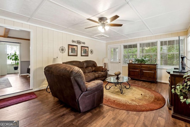 living room with dark hardwood / wood-style flooring and ceiling fan