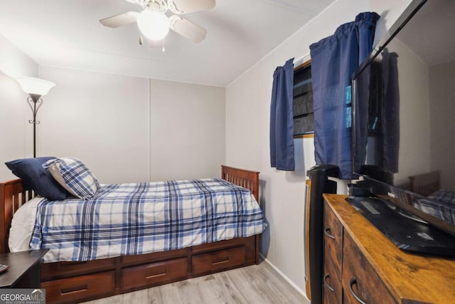 bedroom featuring ceiling fan and light hardwood / wood-style flooring