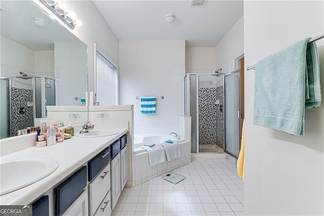 bathroom with vanity, shower with separate bathtub, and tile patterned flooring