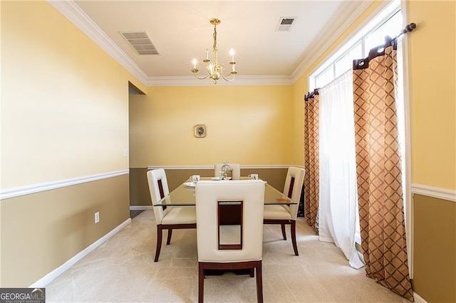 carpeted dining room with a notable chandelier and crown molding