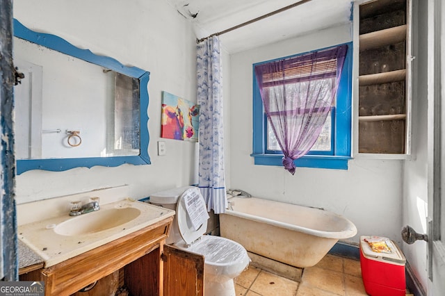 full bathroom featuring vanity, shower / tub combo, tile patterned floors, and toilet