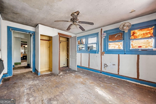 unfurnished bedroom with wood-type flooring and ceiling fan