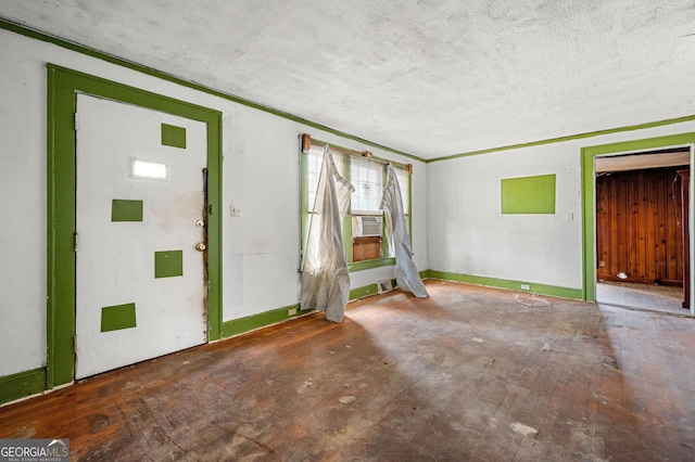 entrance foyer featuring cooling unit and a textured ceiling