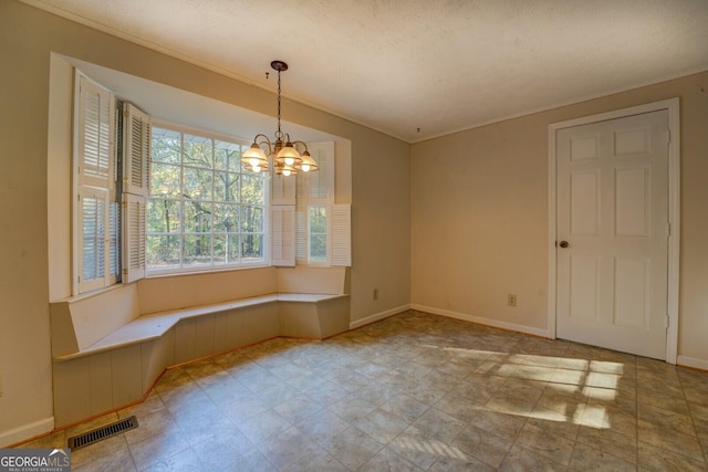 unfurnished dining area with an inviting chandelier and a textured ceiling