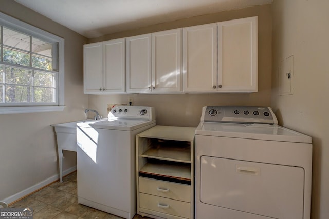 laundry area with cabinets and independent washer and dryer