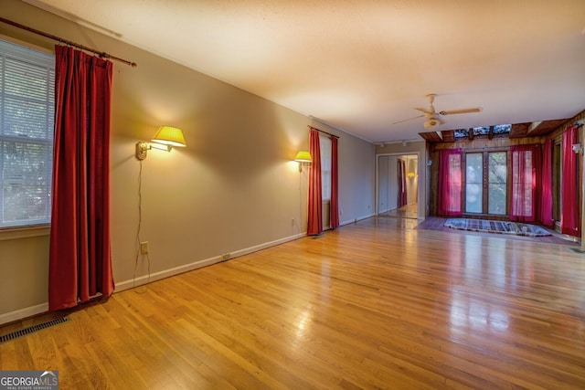 unfurnished room with light hardwood / wood-style flooring and ceiling fan