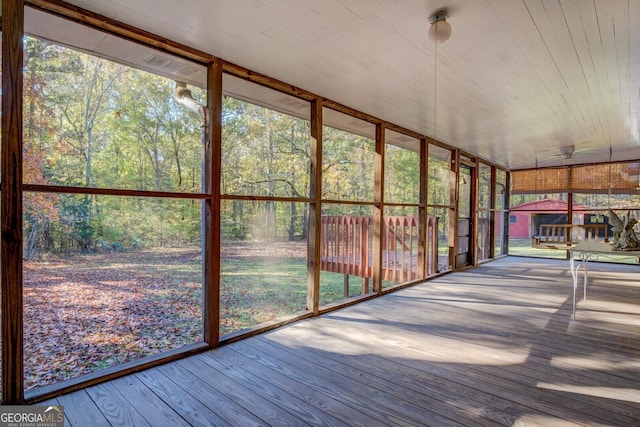 unfurnished sunroom with plenty of natural light