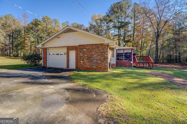 view of property exterior with a garage, a yard, and a deck