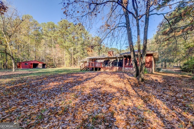 view of yard featuring a sunroom