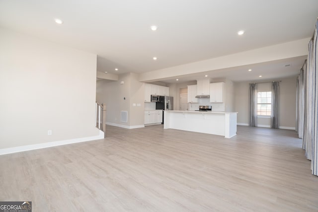 unfurnished living room featuring light hardwood / wood-style flooring