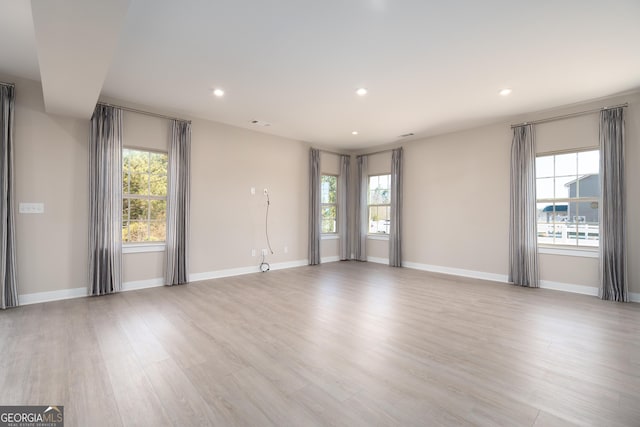 unfurnished room with light hardwood / wood-style floors