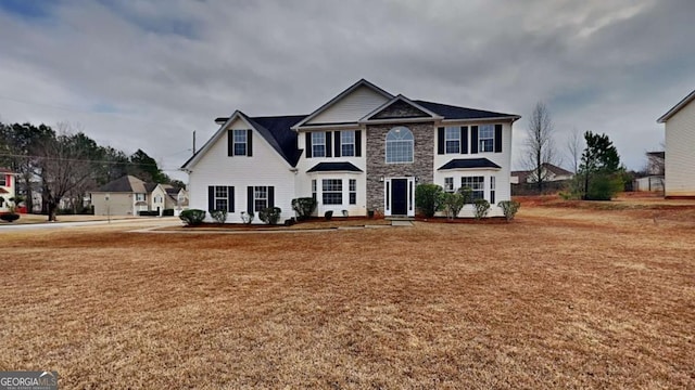 view of front of home featuring a front lawn