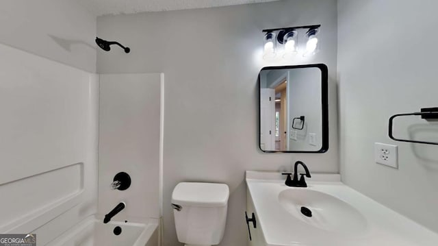 full bathroom with bathing tub / shower combination, vanity, a textured ceiling, and toilet