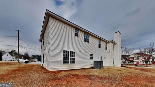 back of property with central air condition unit