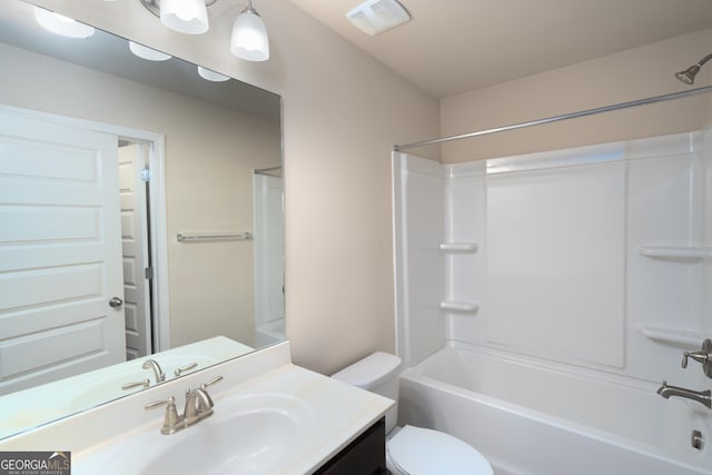 full bathroom featuring shower / bathing tub combination, vanity, and toilet