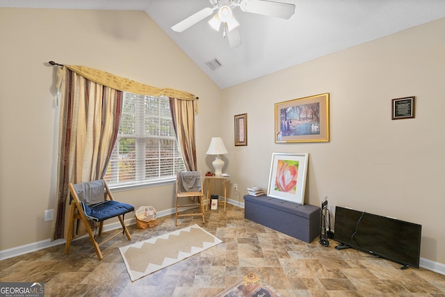 living area featuring high vaulted ceiling and ceiling fan