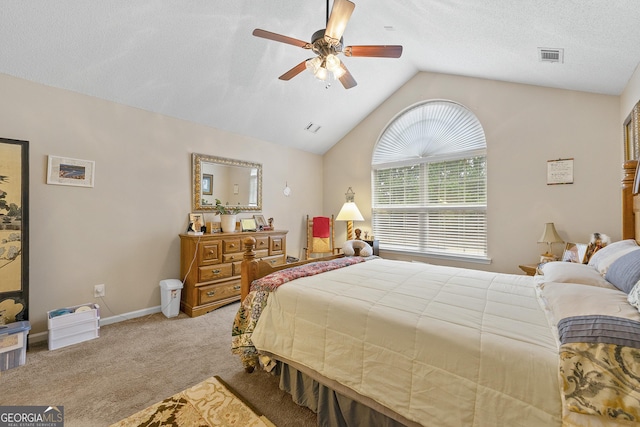 bedroom featuring ceiling fan, vaulted ceiling, and light carpet