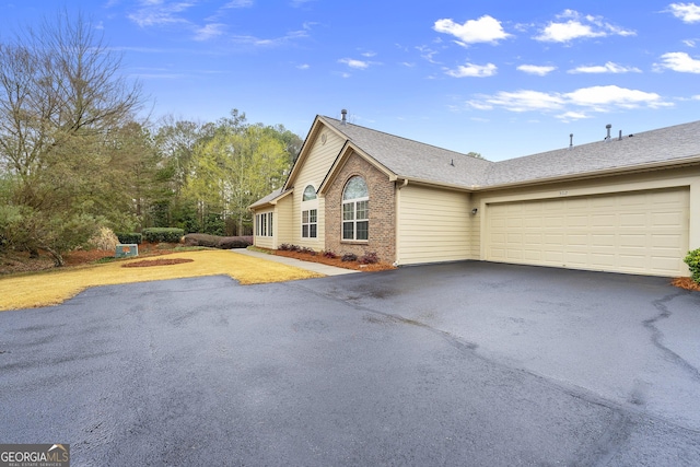 view of side of home featuring a garage