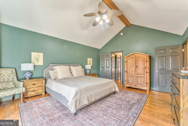 bedroom with vaulted ceiling with beams, ceiling fan, and light hardwood / wood-style floors