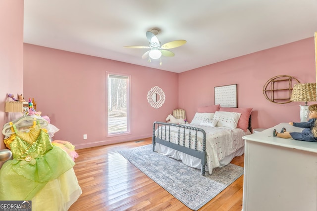 bedroom featuring ceiling fan and light hardwood / wood-style floors