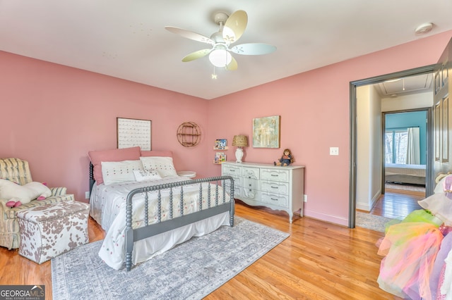 bedroom featuring ceiling fan and light wood-type flooring