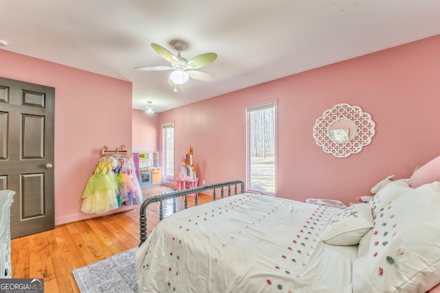 bedroom with hardwood / wood-style flooring and ceiling fan