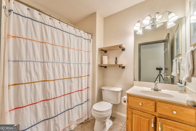 bathroom with tile patterned flooring, vanity, curtained shower, and toilet