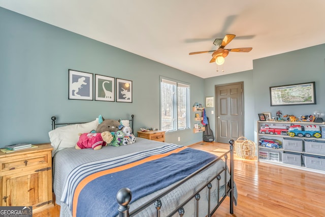 bedroom featuring hardwood / wood-style flooring and ceiling fan