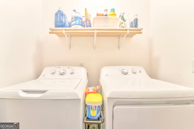 clothes washing area featuring separate washer and dryer