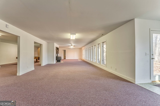 unfurnished room with plenty of natural light and light carpet