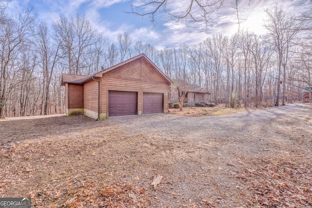 view of side of property featuring a garage