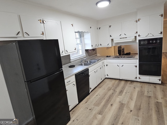 kitchen with sink, black appliances, white cabinets, and light wood-type flooring