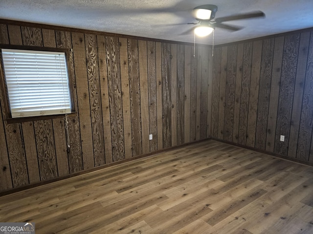 unfurnished room featuring hardwood / wood-style flooring and ceiling fan