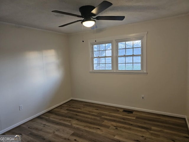 unfurnished room featuring crown molding, ceiling fan, dark hardwood / wood-style flooring, and a textured ceiling