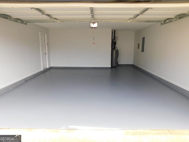 garage featuring a garage door opener, electric panel, and water heater