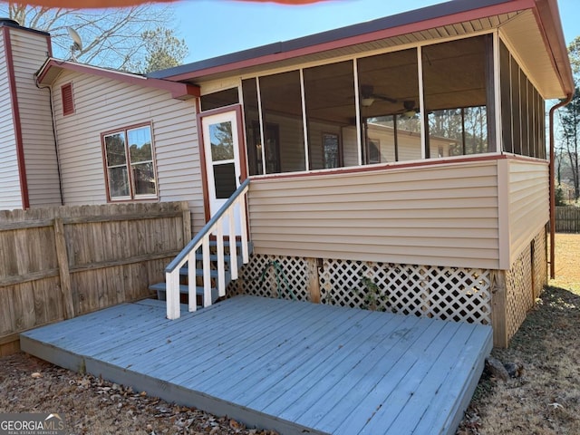 wooden deck featuring a sunroom