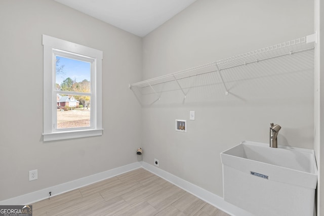 laundry room with washer hookup, sink, and electric dryer hookup