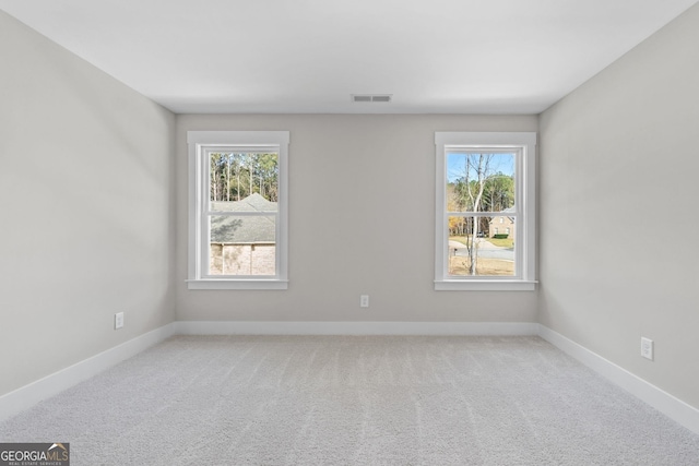 empty room with carpet flooring