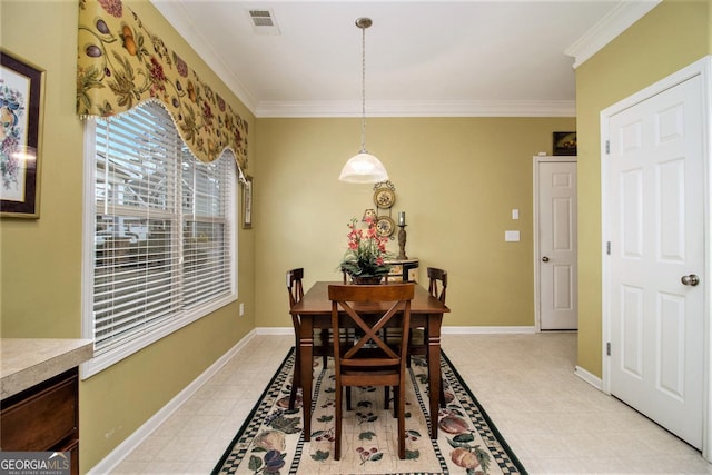 dining room featuring ornamental molding