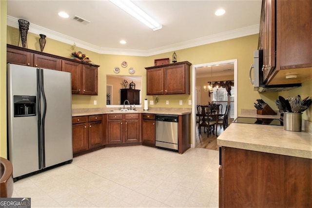 kitchen featuring sink, decorative light fixtures, a chandelier, ornamental molding, and appliances with stainless steel finishes