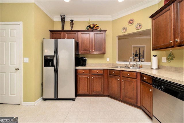 kitchen featuring crown molding, stainless steel appliances, and sink