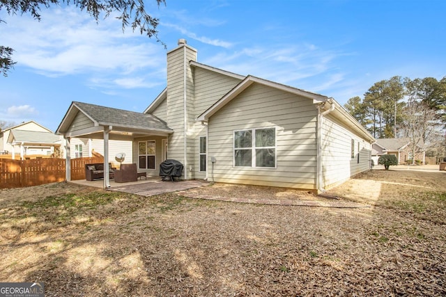 rear view of property with a patio area