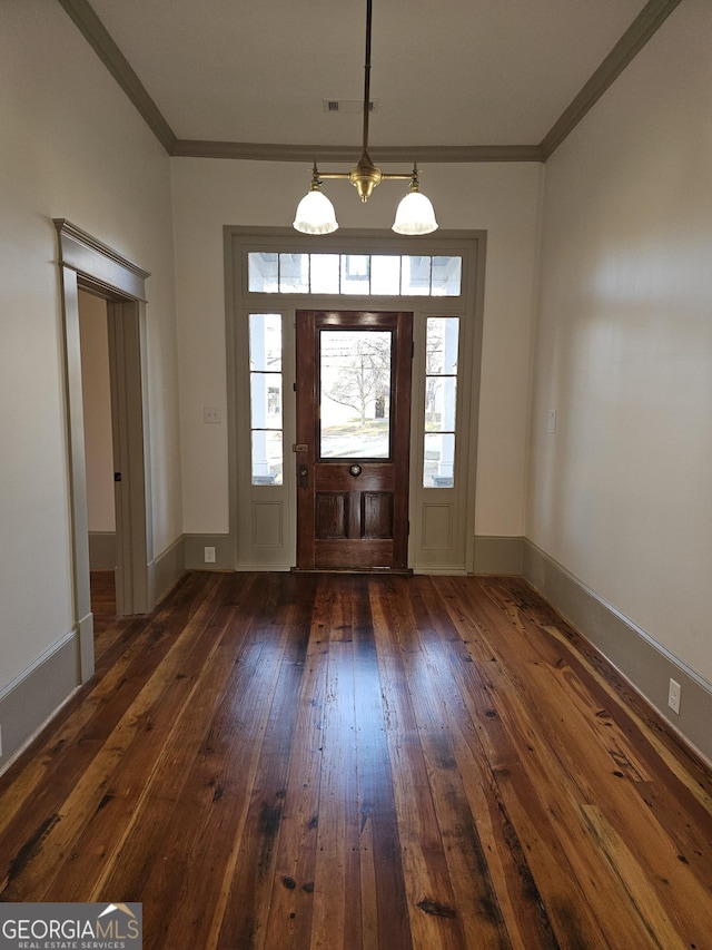 213 W Hightower Trl, Social Circle, GA 30025 - entrance foyer with dark wood-style flooring, ornamental molding, healthy amount of natural light, and baseboards