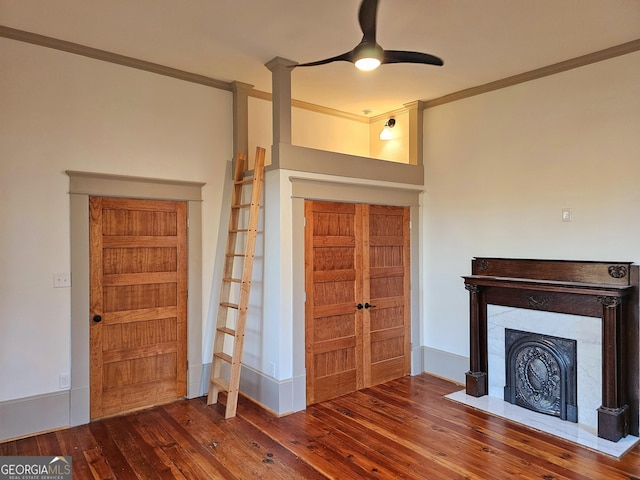 213 W Hightower Trl, Social Circle, GA 30025 - entrance foyer with hardwood / wood-style floors, ornamental molding, a ceiling fan, and a fireplace with flush hearth