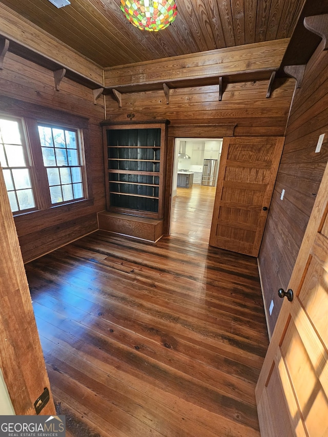 213 W Hightower Trl, Social Circle, GA 30025 - unfurnished room with wood ceiling, wooden walls, dark wood finished floors, and beam ceiling